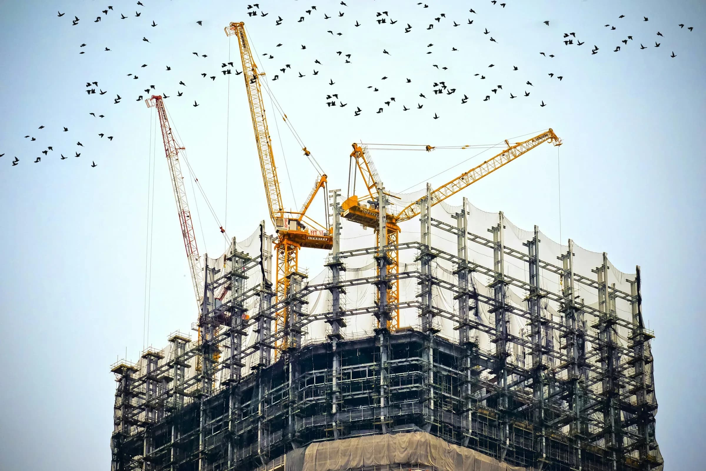 Dense London development site with tower cranes — financing and delivery structure